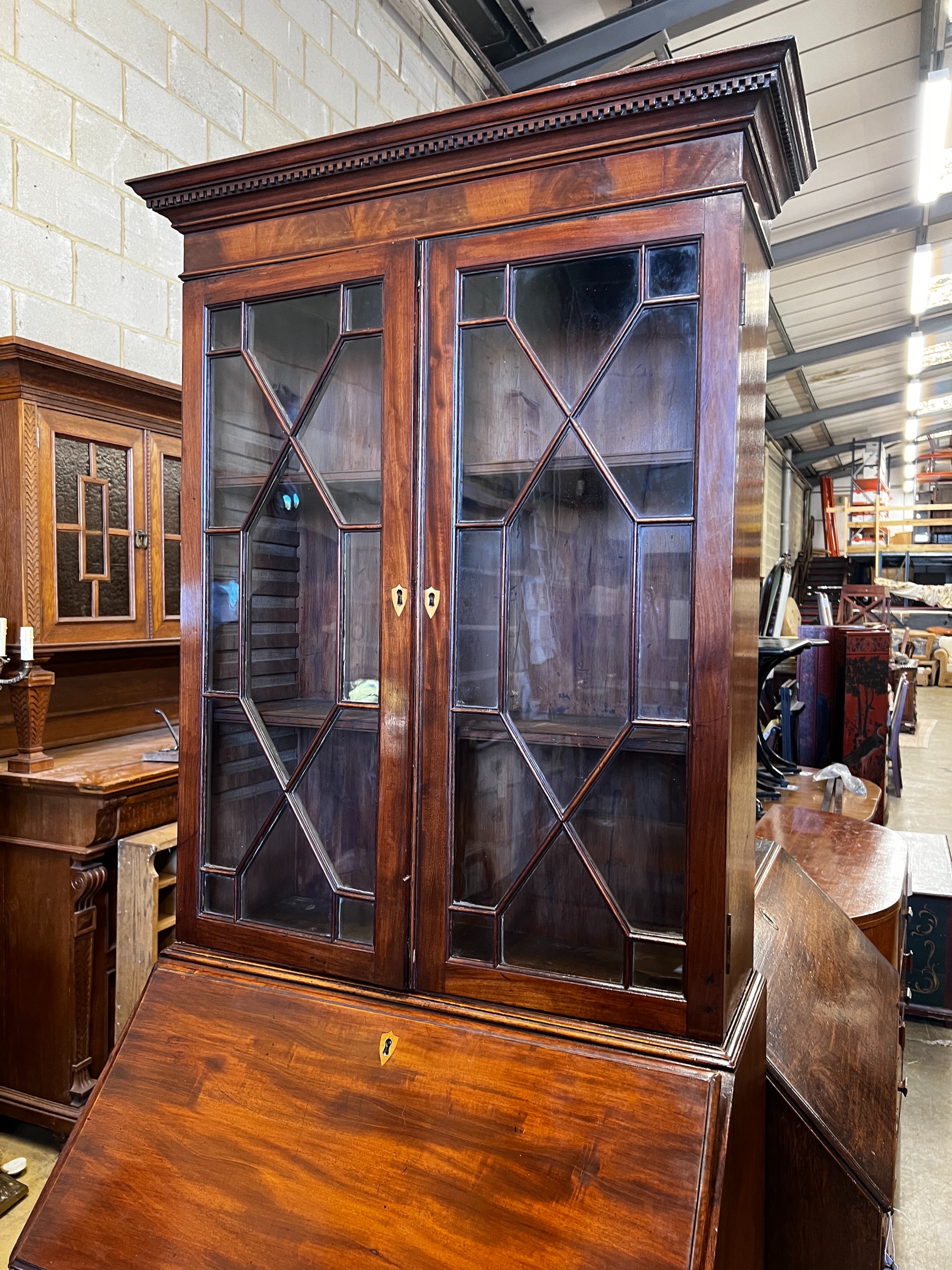 A George III style narrow mahogany bureau bookcase, width 75cm, depth 51cm, height 208cm